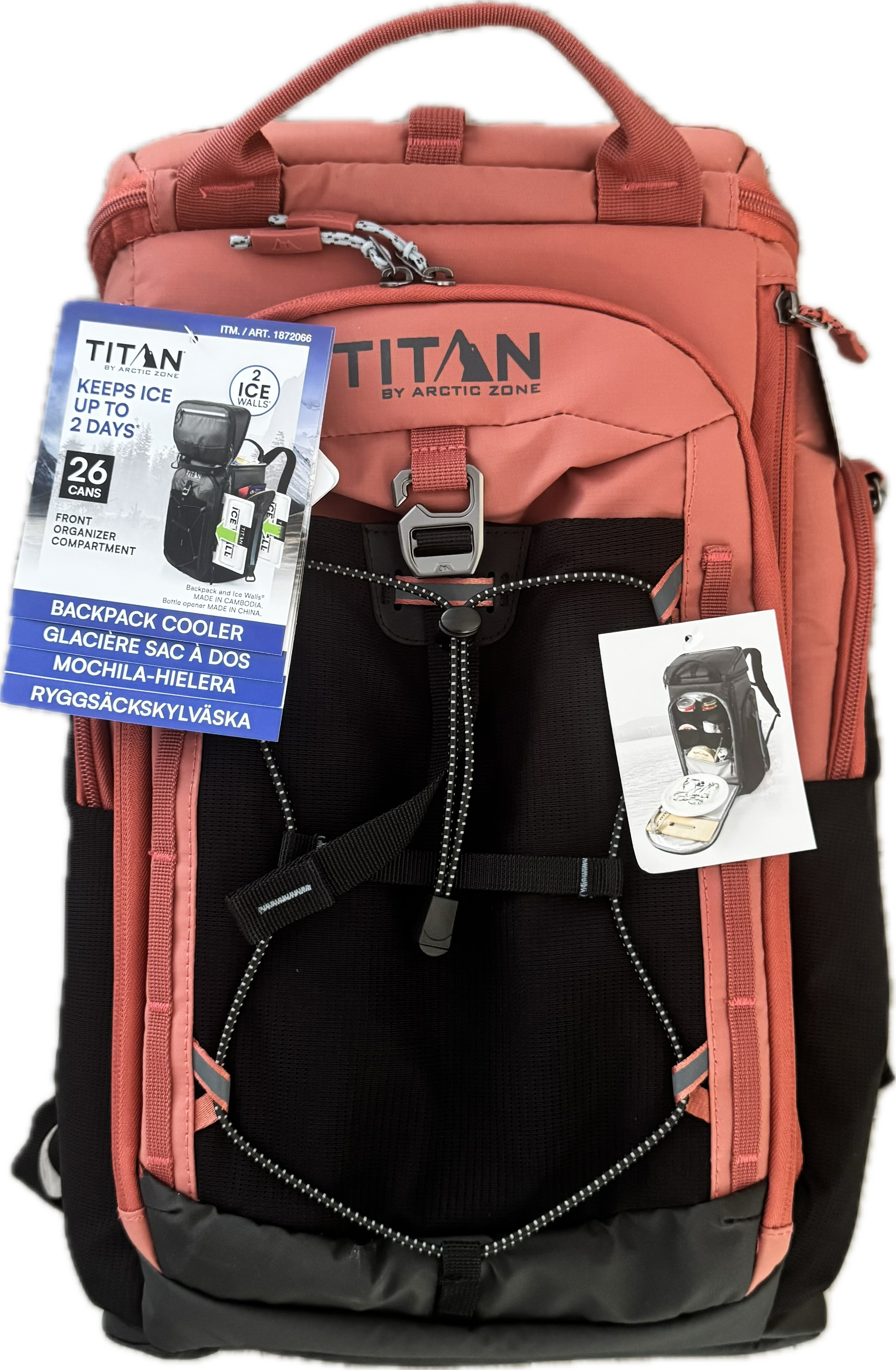 A Titan by Arctic Zone backpack in terracotta pink and black, shown with its included cooler accessory packaging and an informational hangtag against a plain white background.