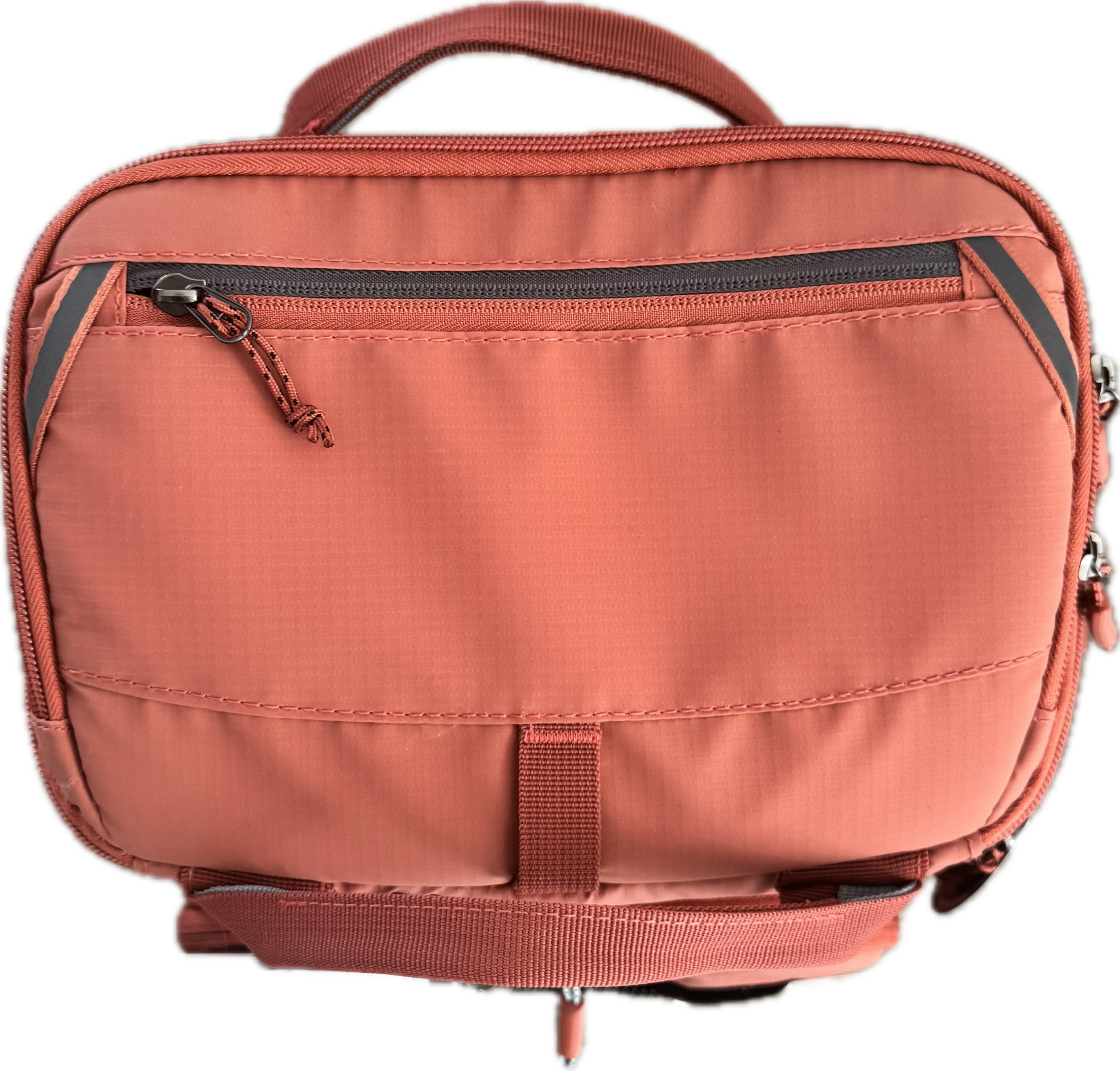 A salmon pink or terracotta-colored nylon camera bag with multiple zippered compartments, a top carry handle, and a front strap closure, shown against a plain white background.