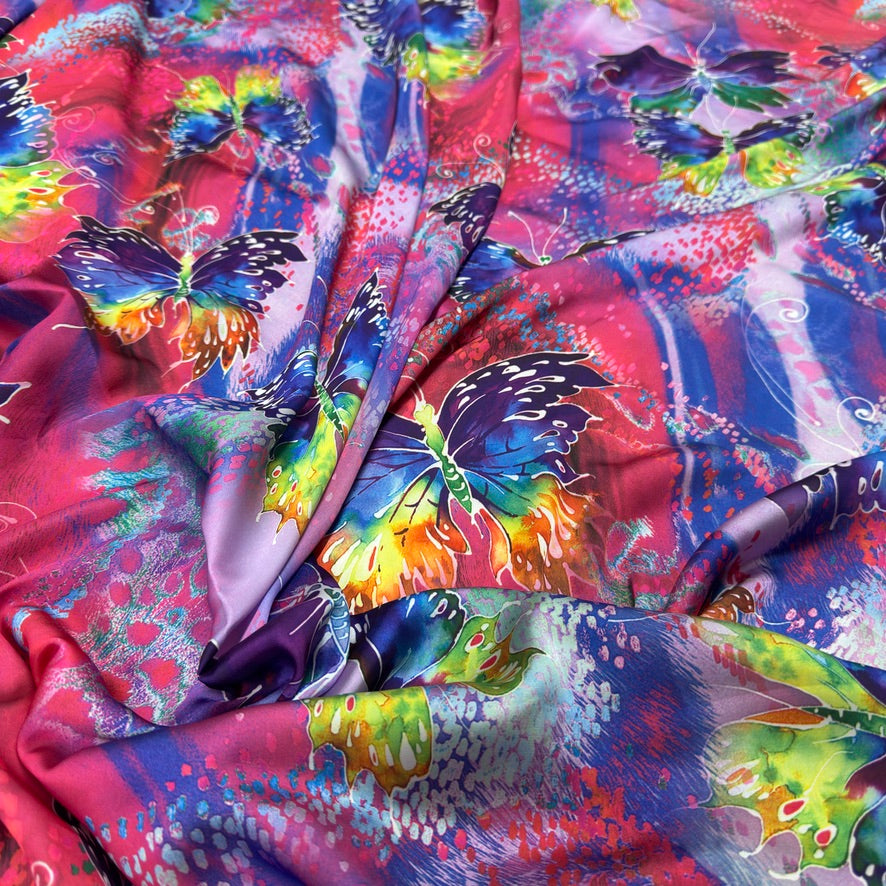 Pink butterfly print silk touch satin fabric with purple, blue, yellow and green butterflies - Bullring Fabrics