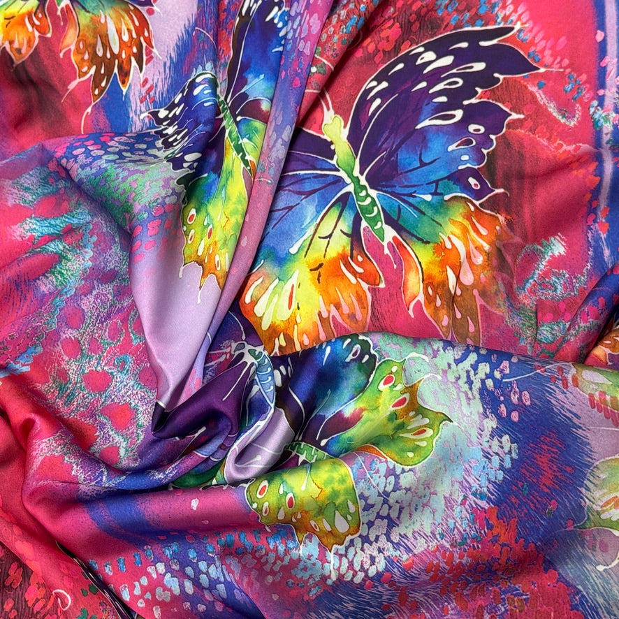 Pink butterfly print silk touch satin fabric with purple, blue, yellow and green butterflies - Bullring Fabrics