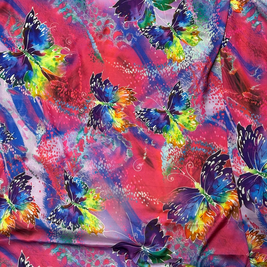 Pink butterfly print silk touch satin fabric with purple, blue, yellow and green butterflies - Bullring Fabrics