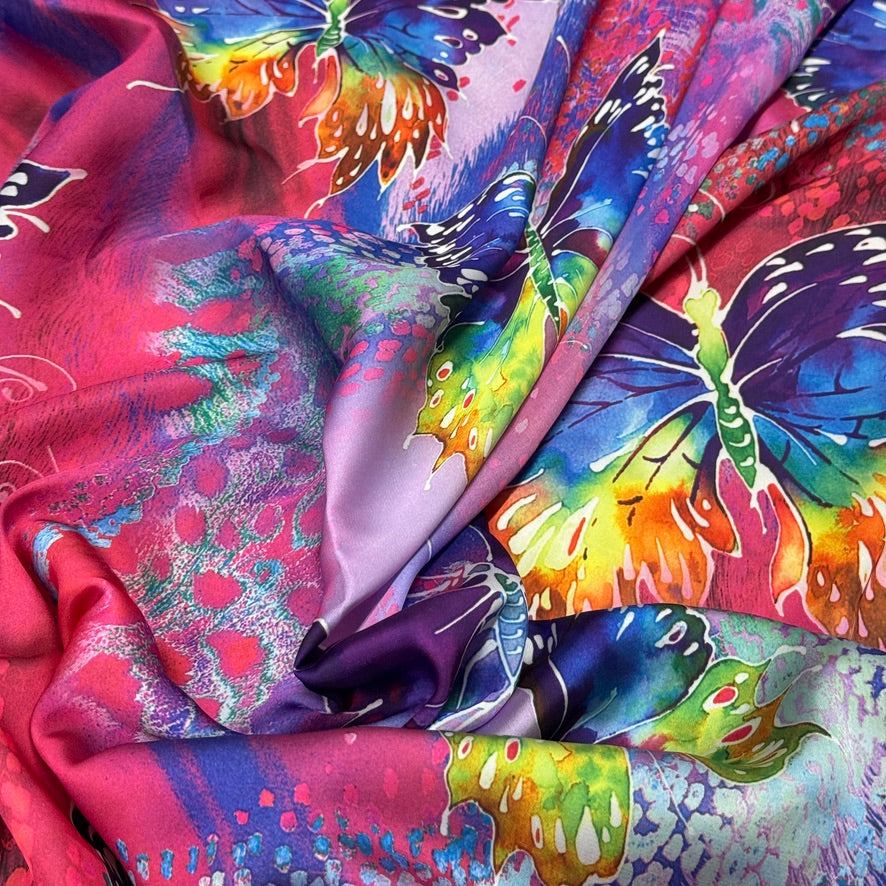 Pink butterfly print silk touch satin fabric with purple, blue, yellow and green butterflies - Bullring Fabrics