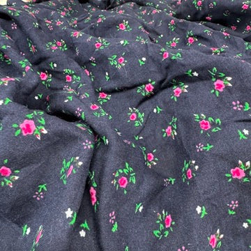 Navy ditsy floral viscose fabric laid out - image 5