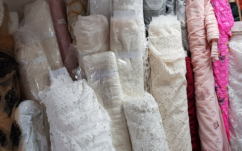 Rolls of bridal and dress lace fabric in the Bullring Fabrics store