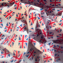 White fabric with an all-over Union Jack flag print, shown in soft folds.