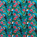 Tropical pattern with toucans, flowers, and leaves on a blue background