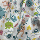 Fabric with colorful alien and space-themed pattern
