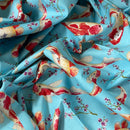 Fabric with red and gold fish pattern on a blue background