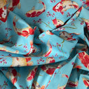 Fabric with red and gold fish pattern on a blue background