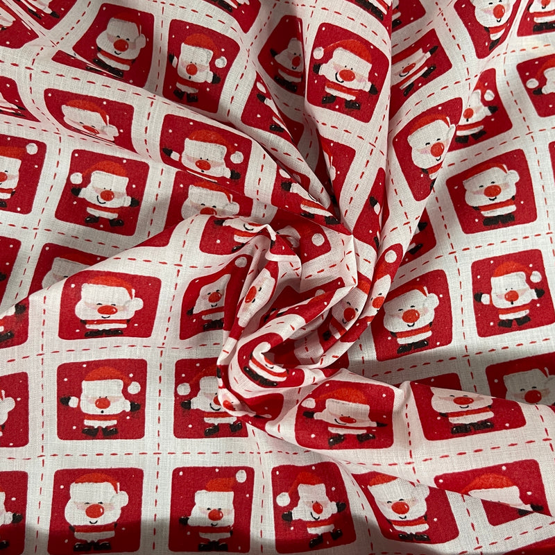 Tissu en polycoton de Noël avec des timbres de Père Noël 