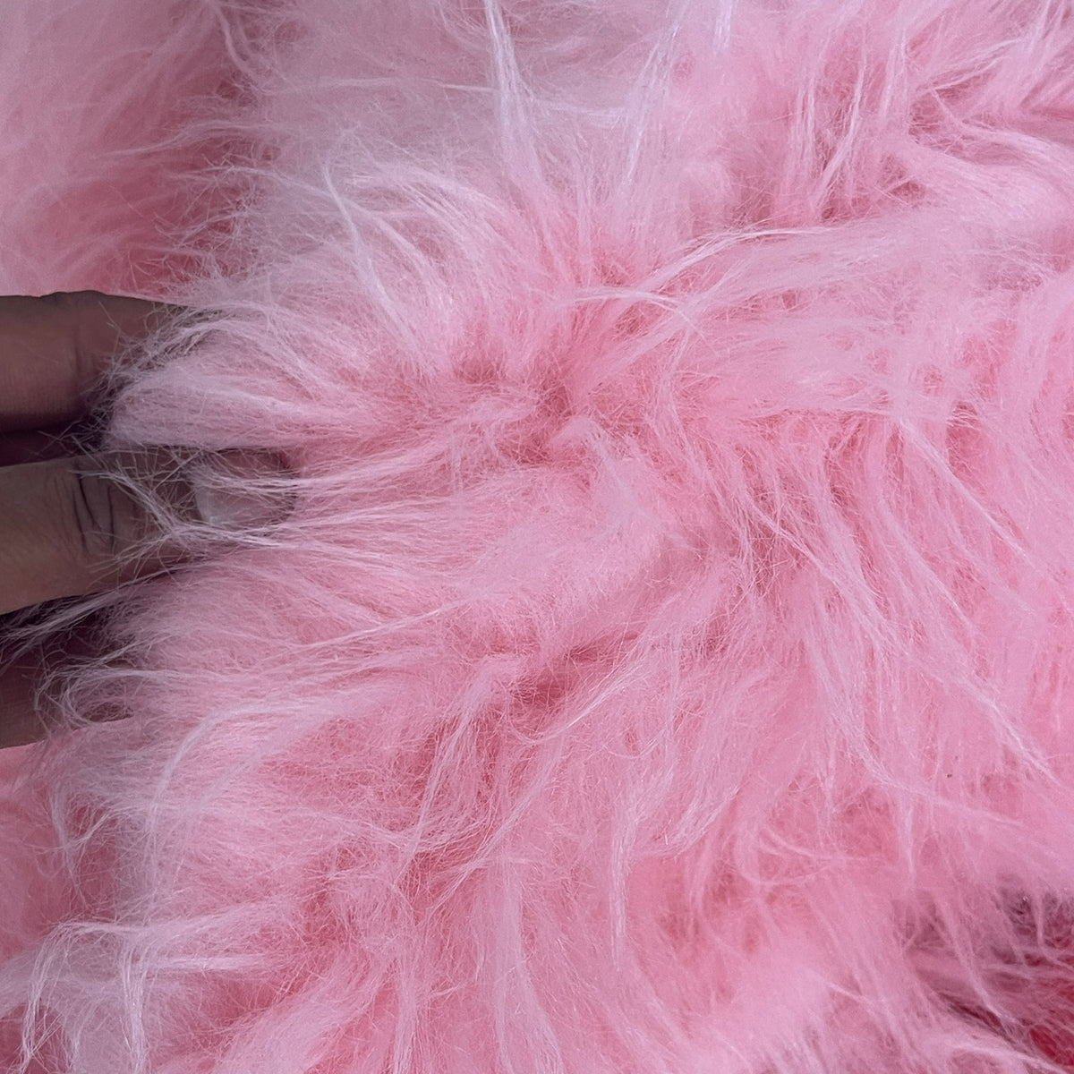 Close-up of fluffy pink long pile faux fur - image 2