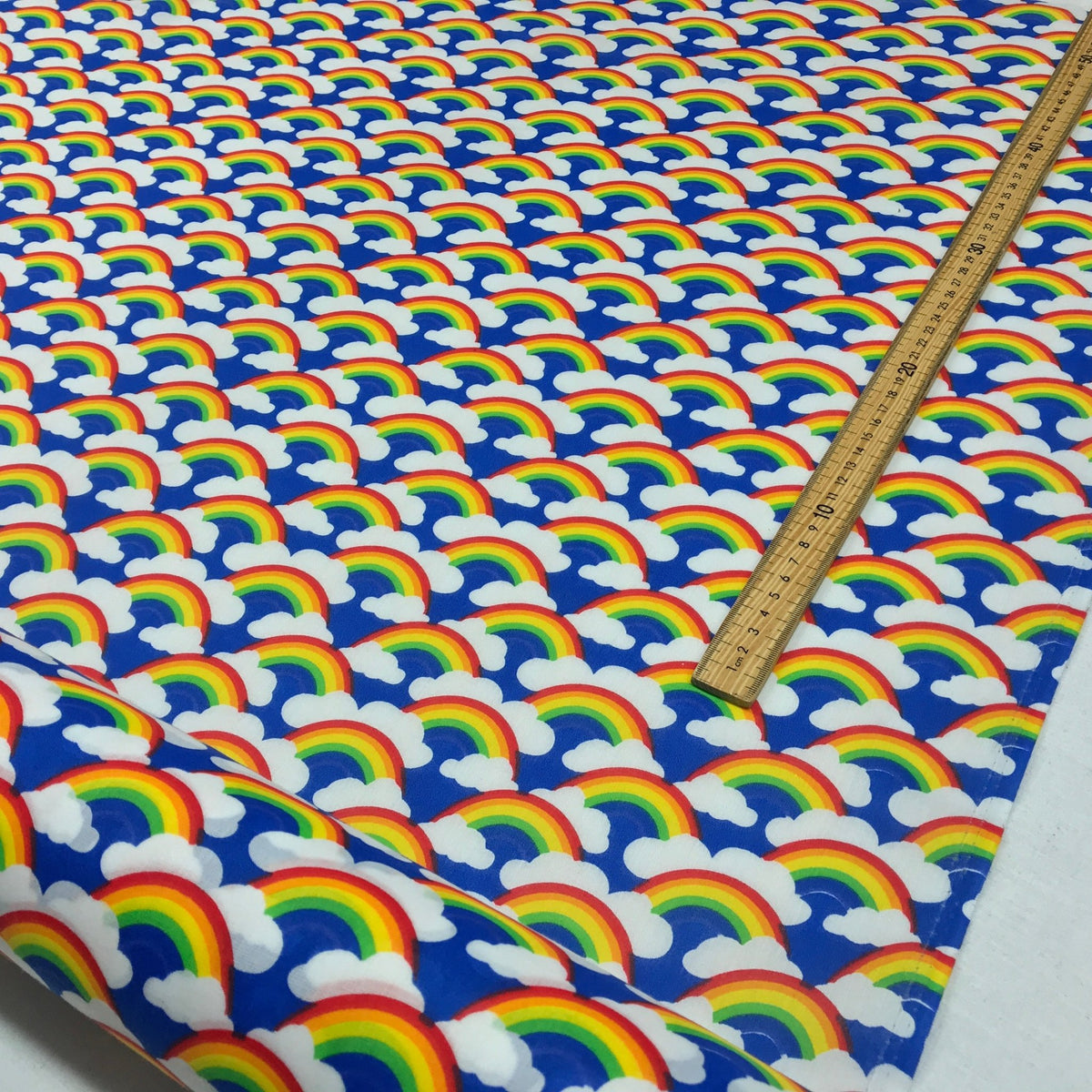 Rainbow In Clouds Polycotton Dress Fabric 45", Royal Blue - Bull Ring Fabrics