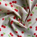 Red Cherries Printed Polycotton Fabric 112cm, Cream - Bull Ring Fabrics