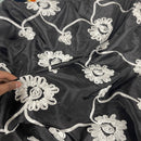 Schwarzer Taftstoff mit Sonnenblumenband, Creme