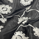 Schwarzer Taftstoff mit Sonnenblumenband, Creme