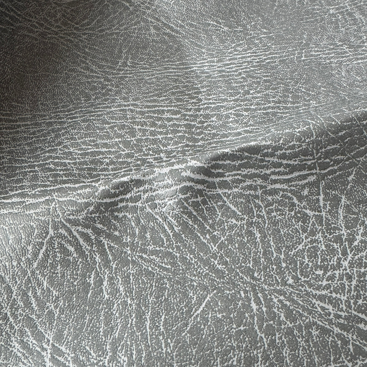 Close-up of distressed grain on grey vinyl faux leather - image 6