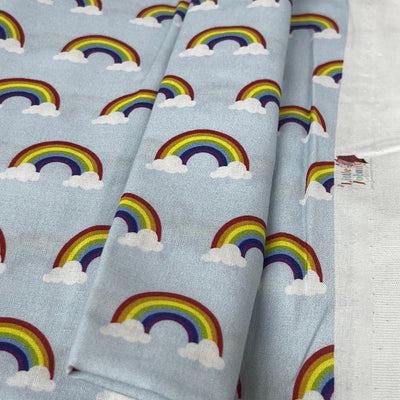 Wholesale Little Johnny 15 Metres Rainbow Clouds 100% Cotton Fabric Roll – Baby Blue Rainbow Print Dress Fabric | Children’s Craft & Quilting Material - Bull Ring Fabrics
